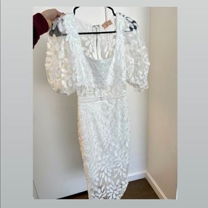 White midi dress with puff sleeves and floral lace